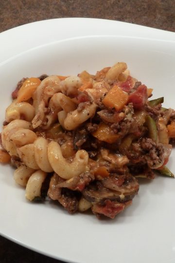 Completed macaroni vegetable casserole on a white plate