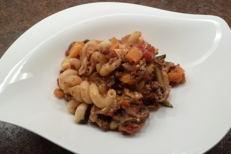 Completed macaroni vegetable casserole on a white plate