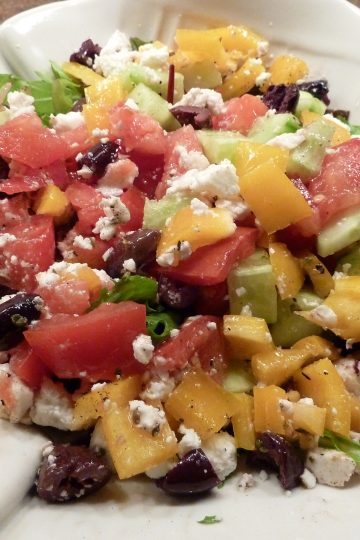 Greek salad on a white plate