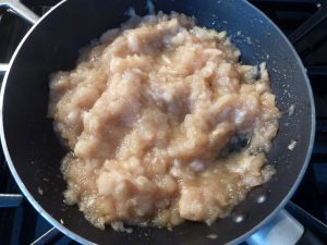 Apples being broken down for applesauce