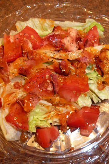 Wedge salad with tomatoes and bacon