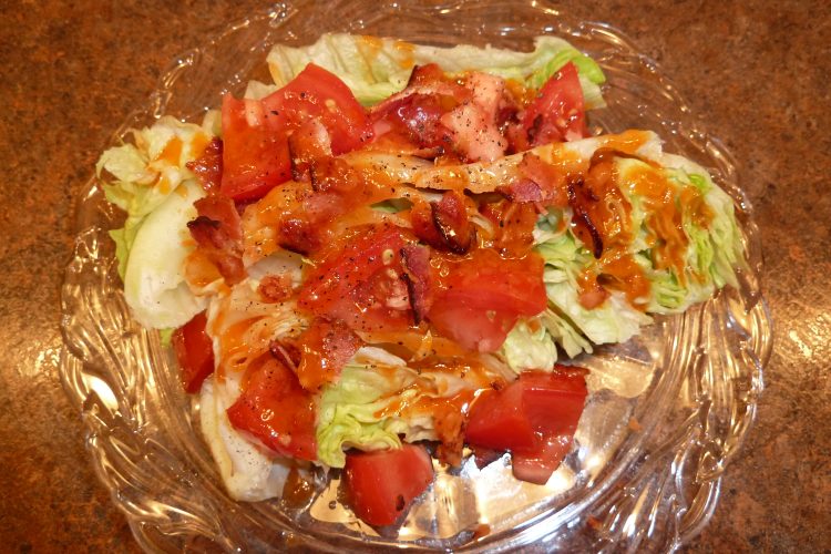 Wedge salad with tomatoes and bacon