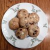 White chocolate chip cookies with cranberries on a white plate