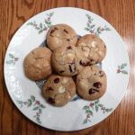 White chocolate chip cookies with cranberries on a white plate