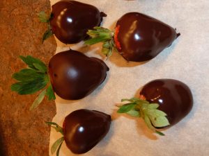 freshly-chocolate-dipped strawberries on waxed paper