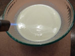Uncooked creme brulee in a bowl