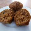 bran muffins on a plate, one cut in half