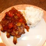 Baked spare ribs plated with mashed potatoes