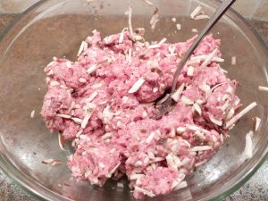 Bowl of ground meat, cheese, and mushrooms.