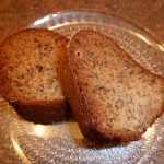 two slices of fresh banana bread on a glass plate
