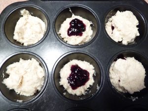 Baked doughnuts in muffin tin, unbaked