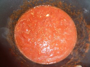 Pot with tomato sauce