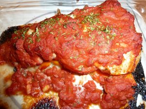 Salmon topped with bacon and sauce baked