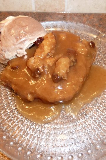 Cinnamon Spice Saucy Cake on a plate with ice cream