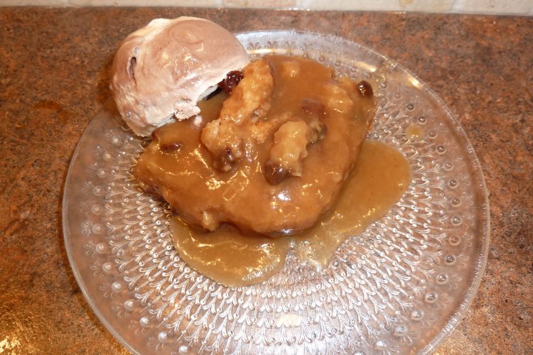 Cinnamon Spice Saucy Cake on a plate with ice cream