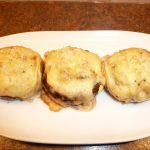 Mushrooms Gratinee presented on a white dish