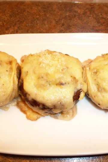 Mushrooms Gratinee presented on a white dish
