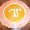Sweet Potato and Pear Soup in a bowl with a Pi in creme fraiche