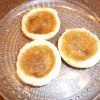Three butter tarts on a plate.