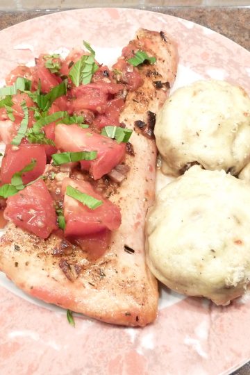Quick Basil Salmon with mushrooms gratinee on a plate.