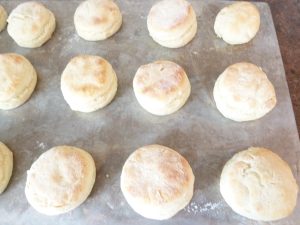 Baked potato biscuits on a baking sheet