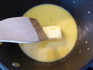 Melting butter in sauce