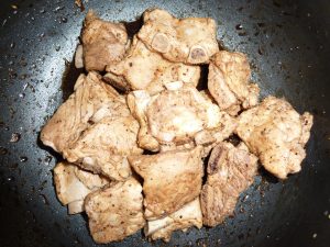 Toss spareribs in marinade